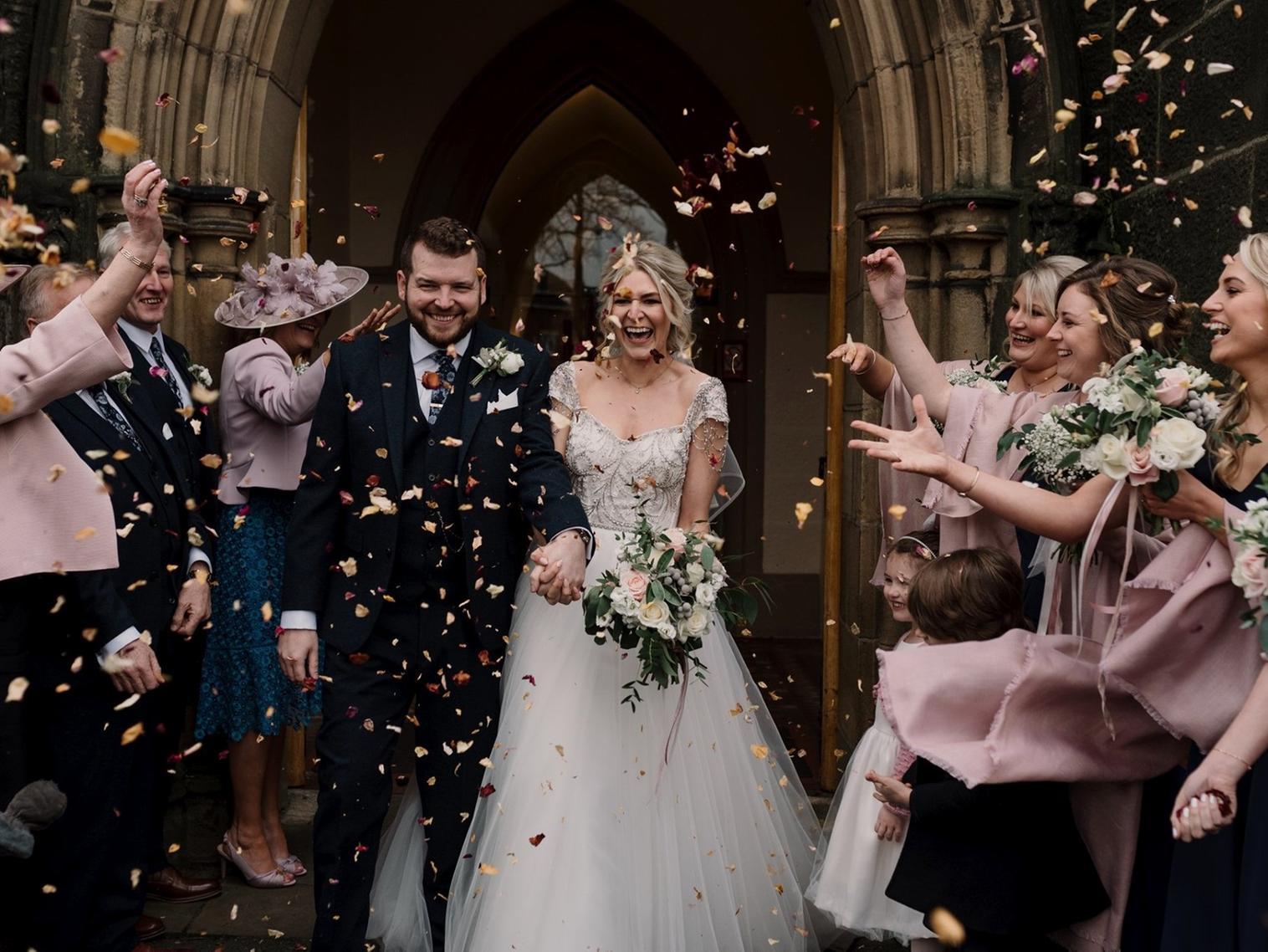 She walked down the aisle to the traditional wedding march, something she had always dreamed of and they aptly listened to Auld Lang Syne during the signing of the register.
