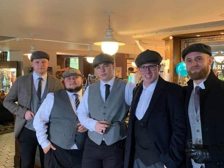 Joe, centre, pictured with family and friends at his Peaky Blinders themed 18th birthday party