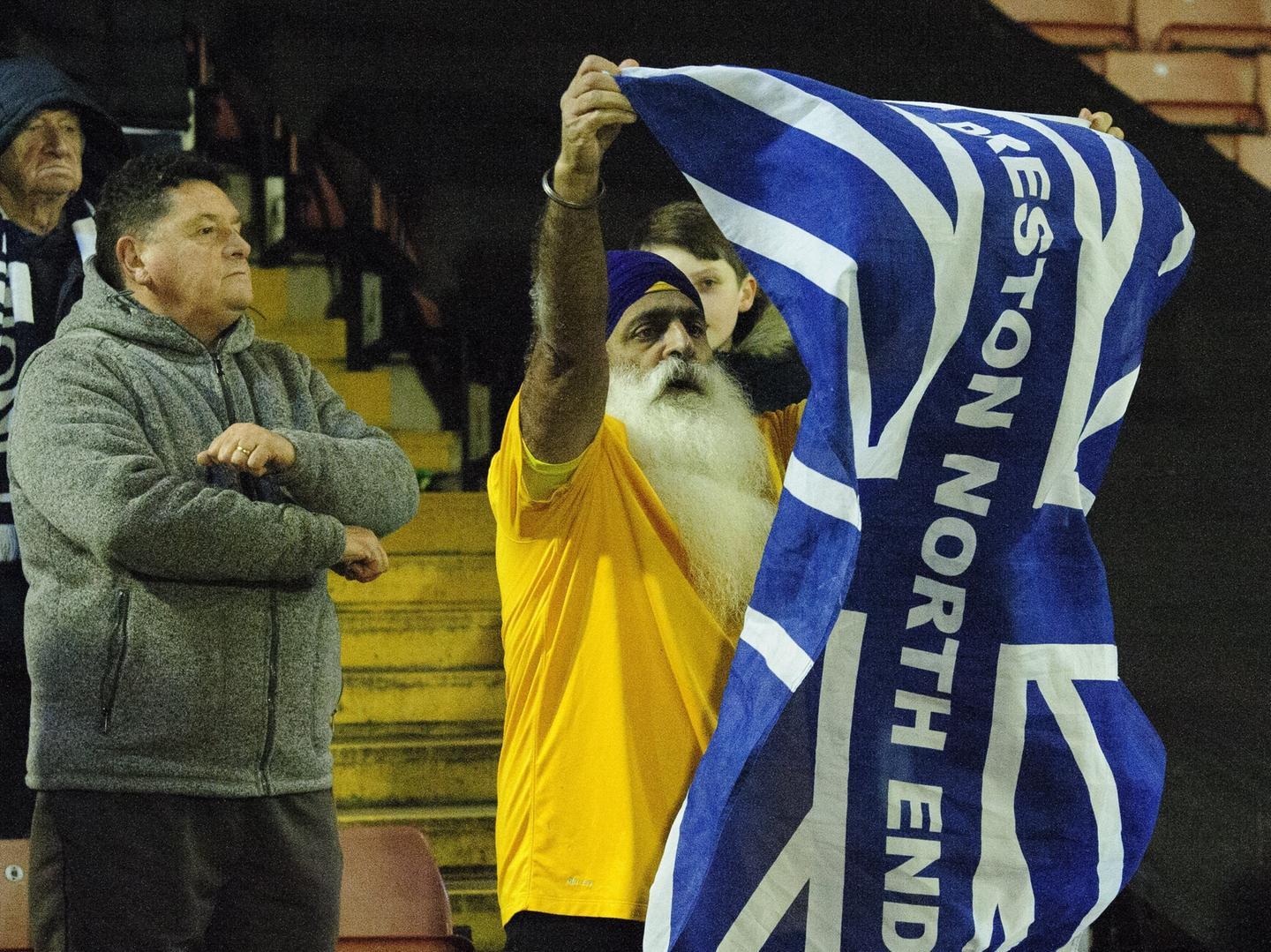 One PNE fan has his flag at the ready to show his support for the visitors.