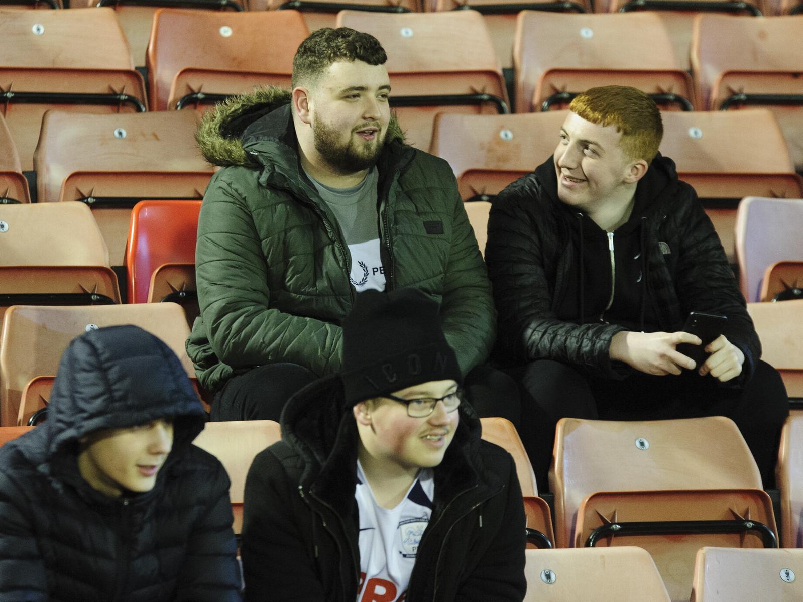 Two pairs of Preston fans have a chat in the build up to the game.