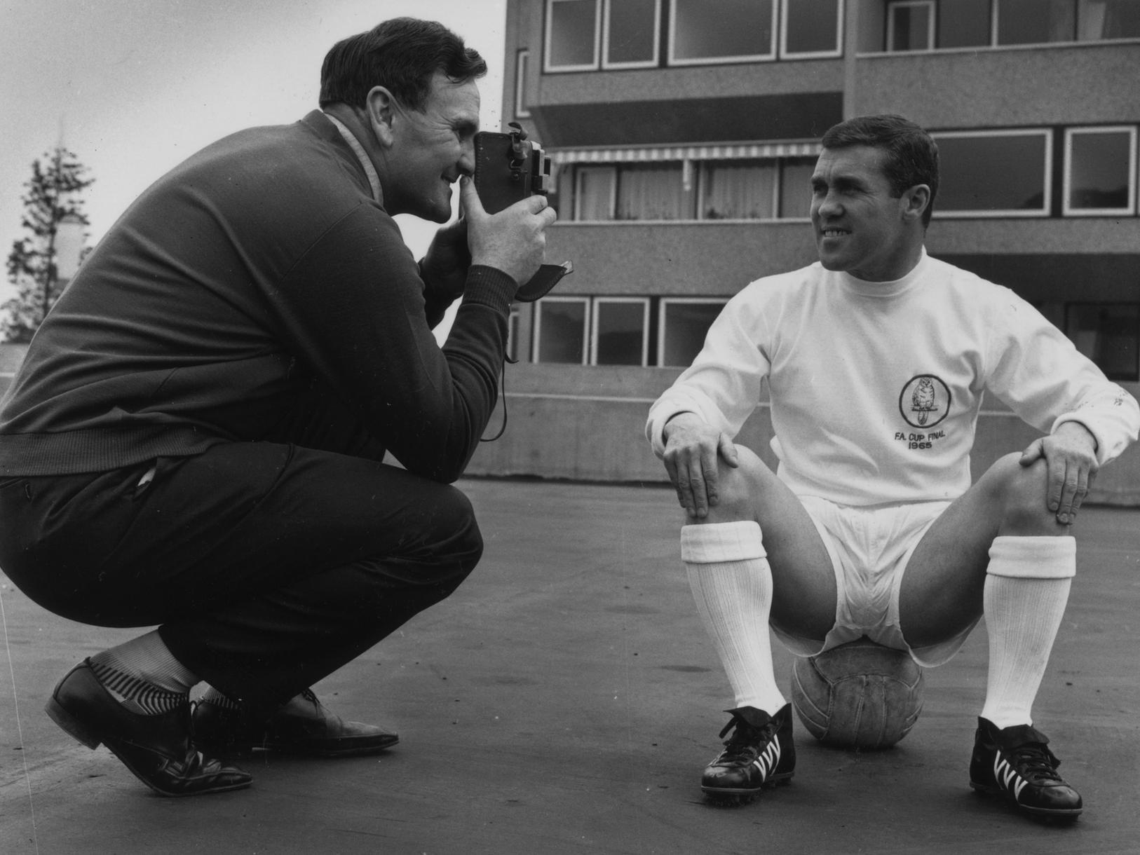 Don Revie, the manager of Leeds United FC, filming Bobby Collins, the team captain.