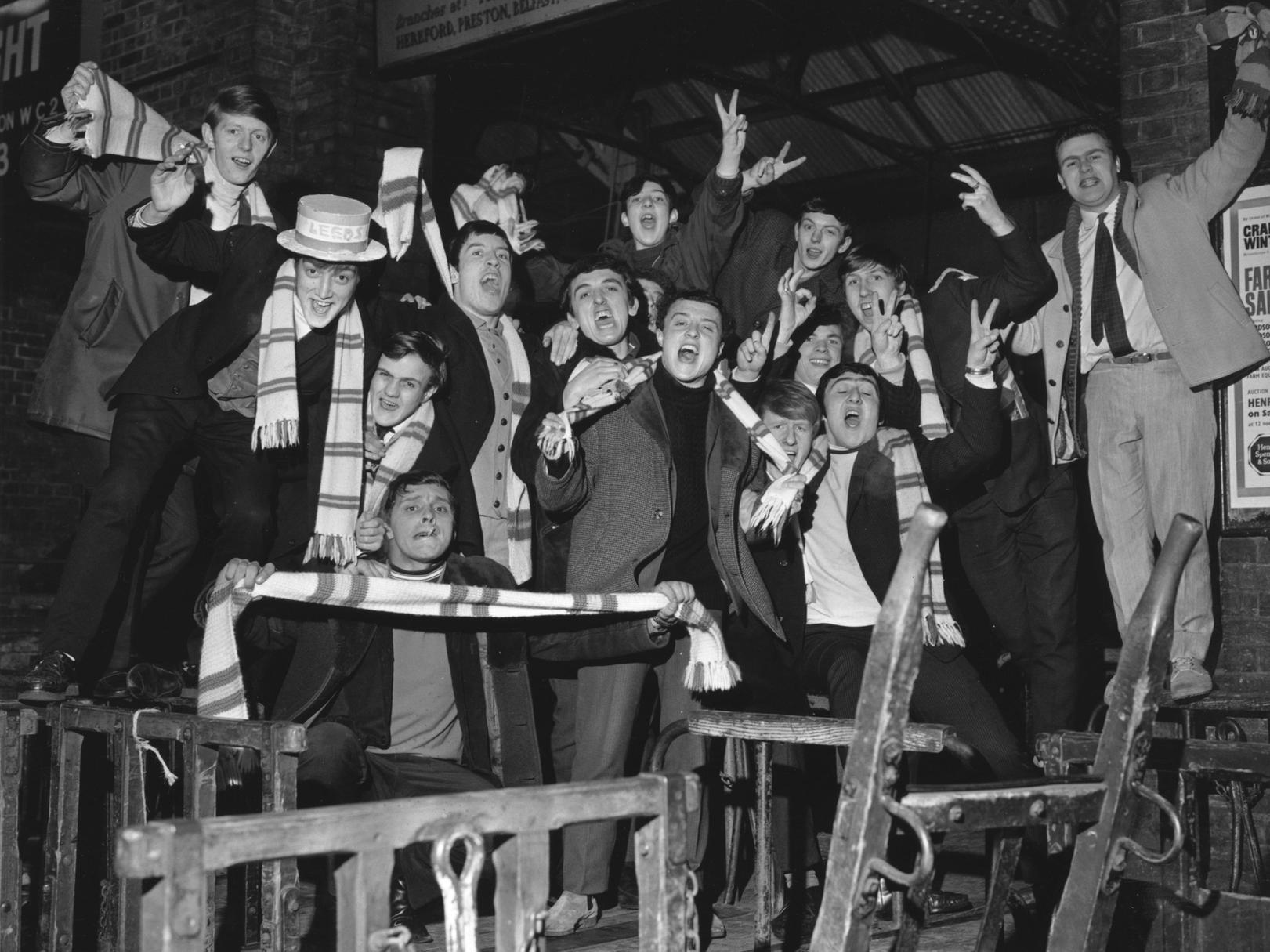 Leeds United football supporters waiting for a train