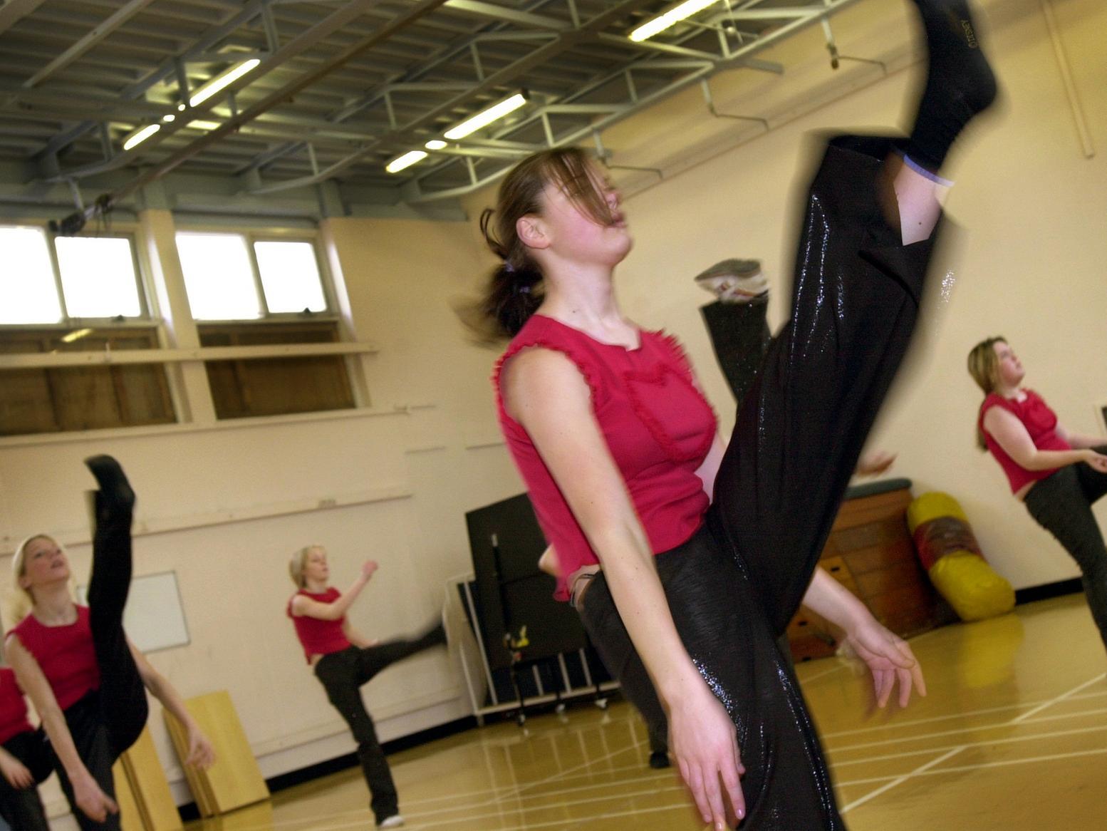 Pupils from Merlyn Rees High School put the finishing touches to a dance routine ahead of the launch of the new South Leeds Arts College in January 2002.