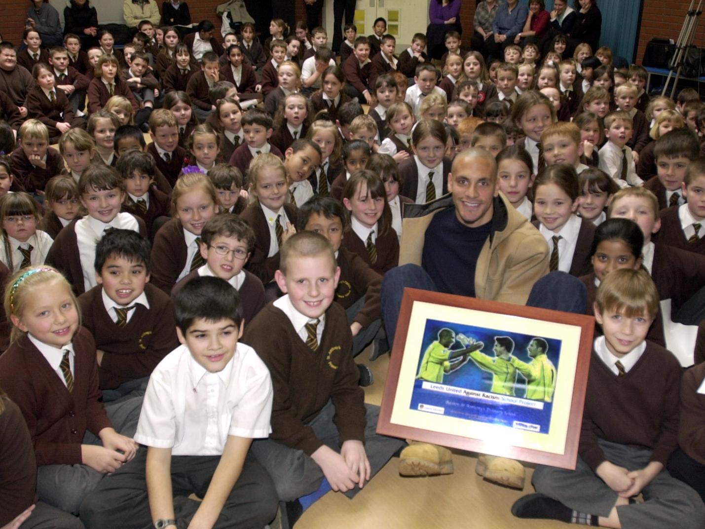 Rio Ferdinand presents the Leeds United Kick Racism Out of Football award to Beeston St. Anthony's Primary School.