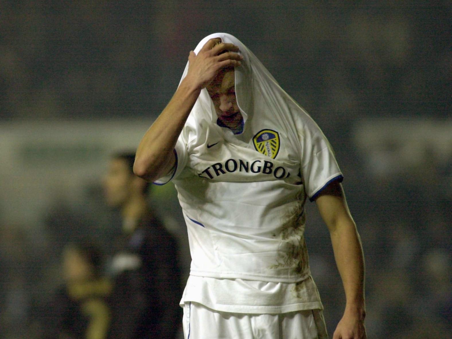 Striker Alan Smith puts his hand on his  head  at the end of the game after Leeds United were beaten 2-1 by Malaga at Elland Road.