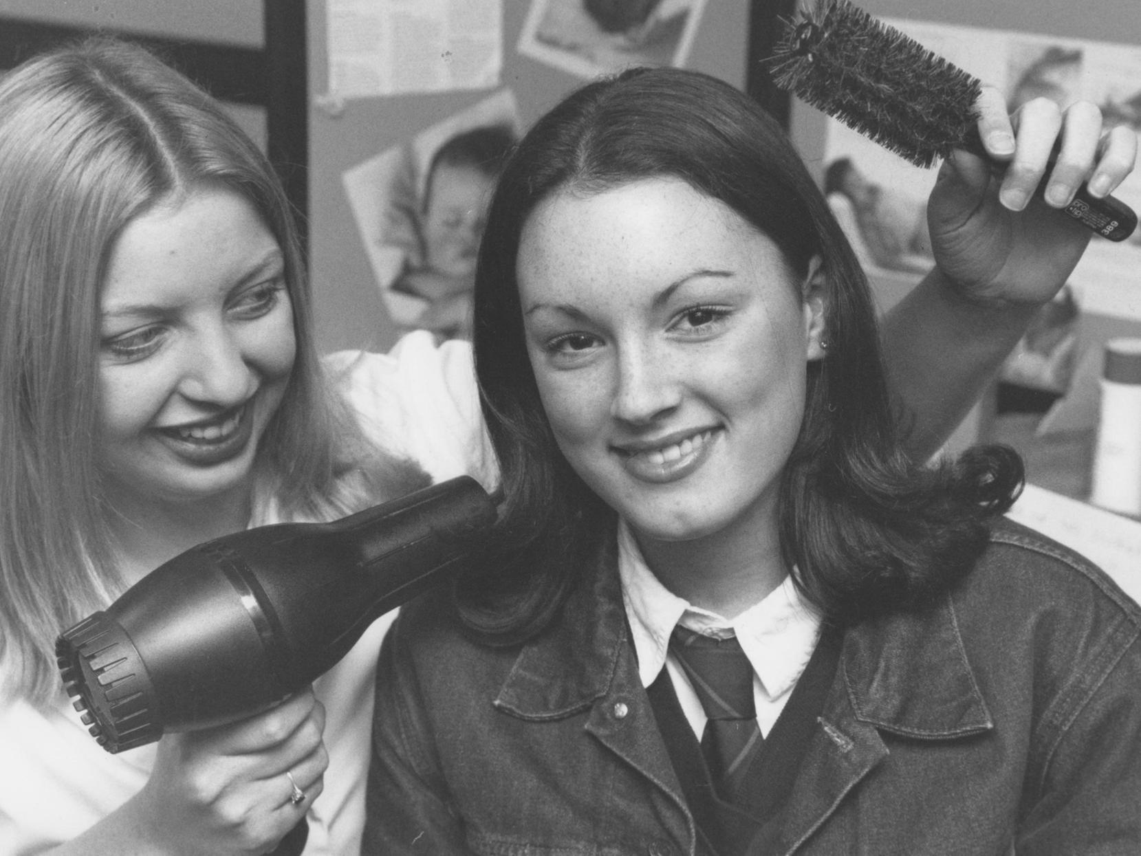 Yorkshire Coast College opened its doors to potential students for its annual open day back in November 1997. Pictured is Nicola Barker, hairdressing student, demonstrating her skills on St Augustine's School pupil Vickie Wyatt.