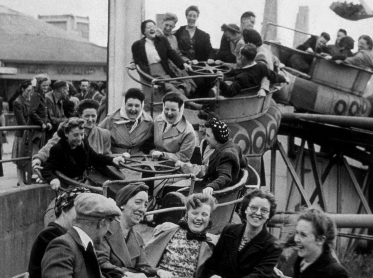 Holidaymakers enjoying fun on the Whip, a ride at Blackpool funfair, May 1936