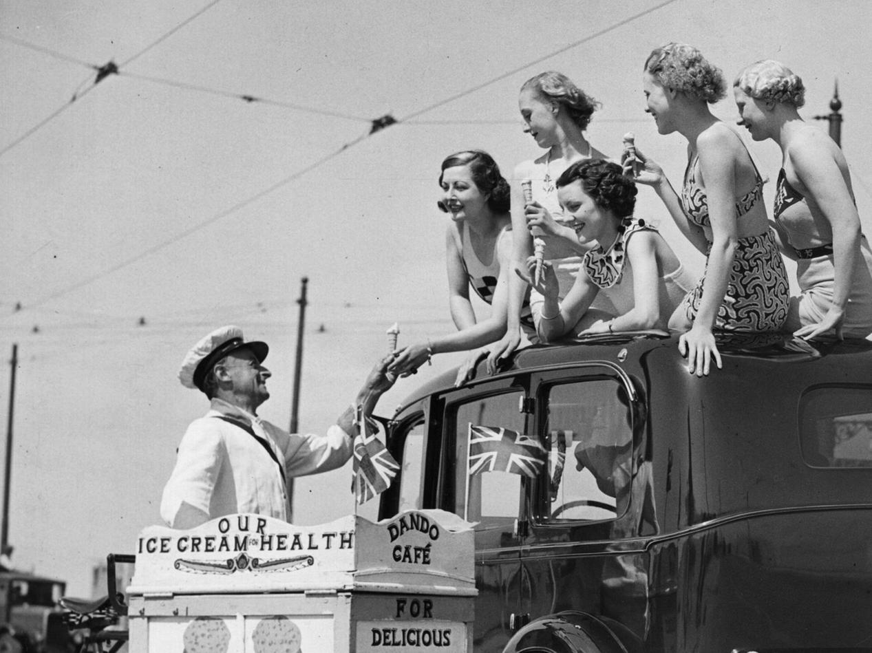 Holidaymakers at Blackpool buying ice-cream from a mobile ice-cream stall, May 1936