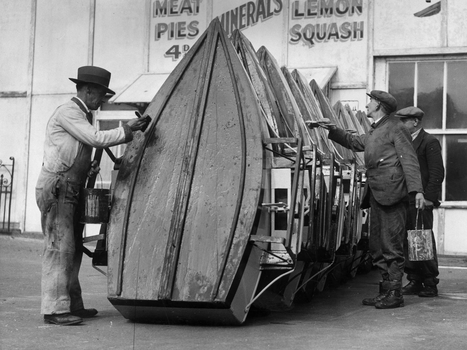 Men painting the pleasure boats at Blackpool Boating Lake  in preparation for the Easter holiday visitors, March 31 1936