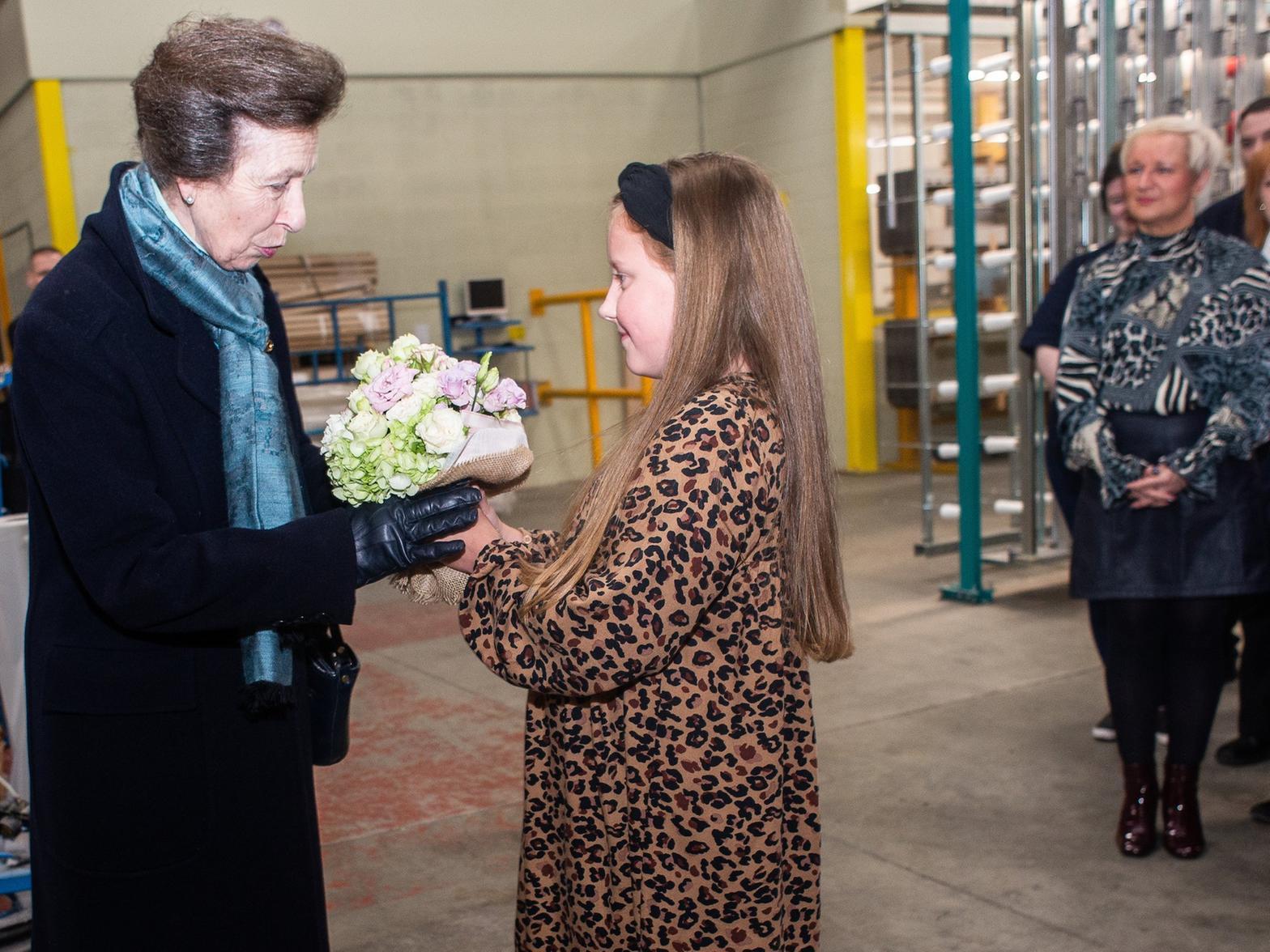 The Princess Royal receives a bouquet from a young guest Pic: Andy Ford