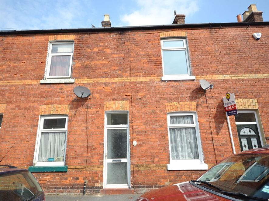This two-bedroom mid-terrace house is being sold by modern auction with a starting bid of 70,000.