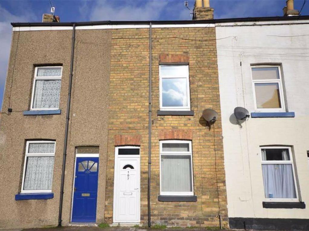 This two-bedroom mid-terrace house is on sale for 80,000. A potential holiday home investment, according to the listing.