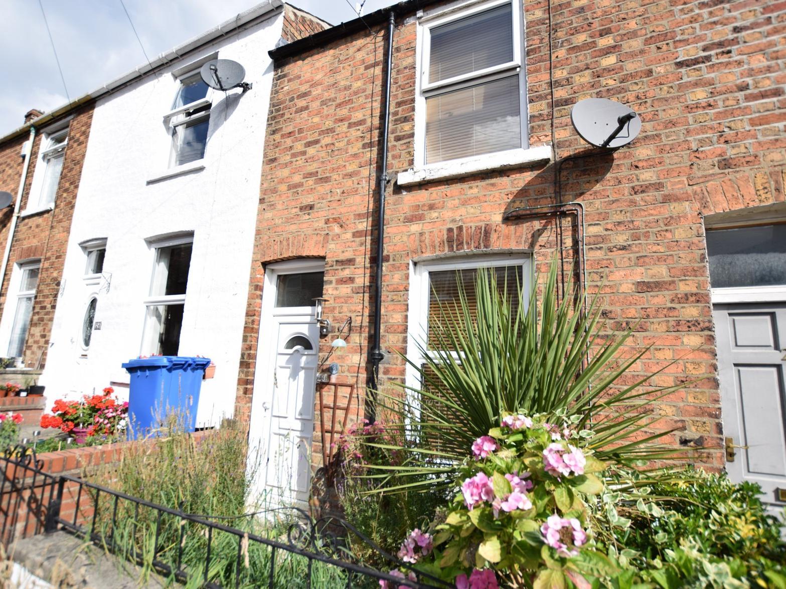 A two-bedroom terrace house on sale for 85,000. The property has a small forecourt and a fully enclosed rear yard.
