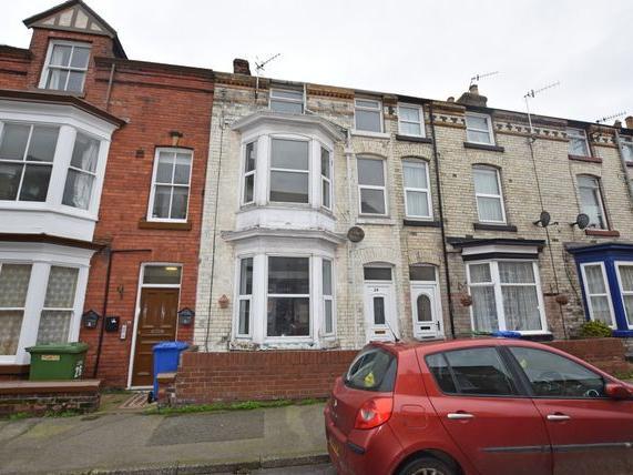 This three-bedroom terraced house is in need of modernisation and is listed for offers in excess of 90,000. It is located close to the railway station and the town centre.