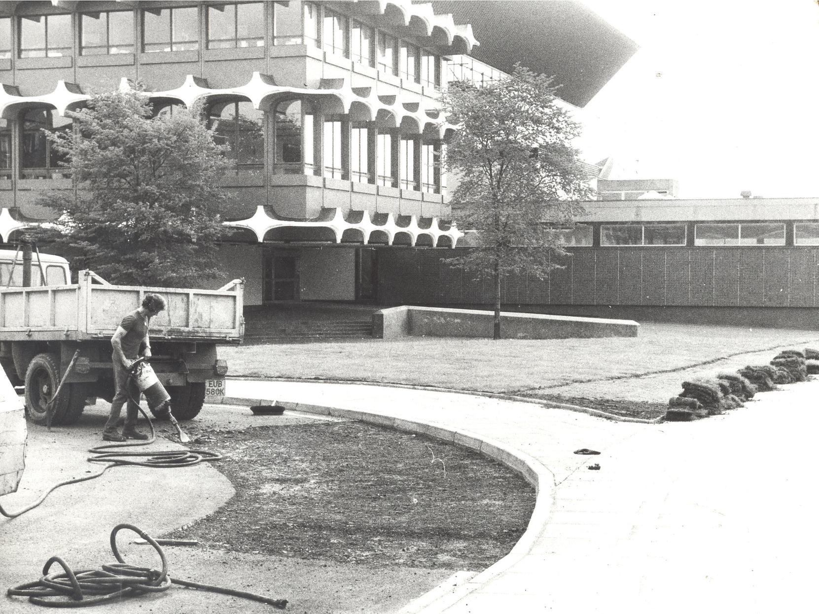 Just weeks after the concourse between Westgate Police Station and the International Pool was landscaped workmen had to dig it up. The Post Office needed access to manholes under the turf.