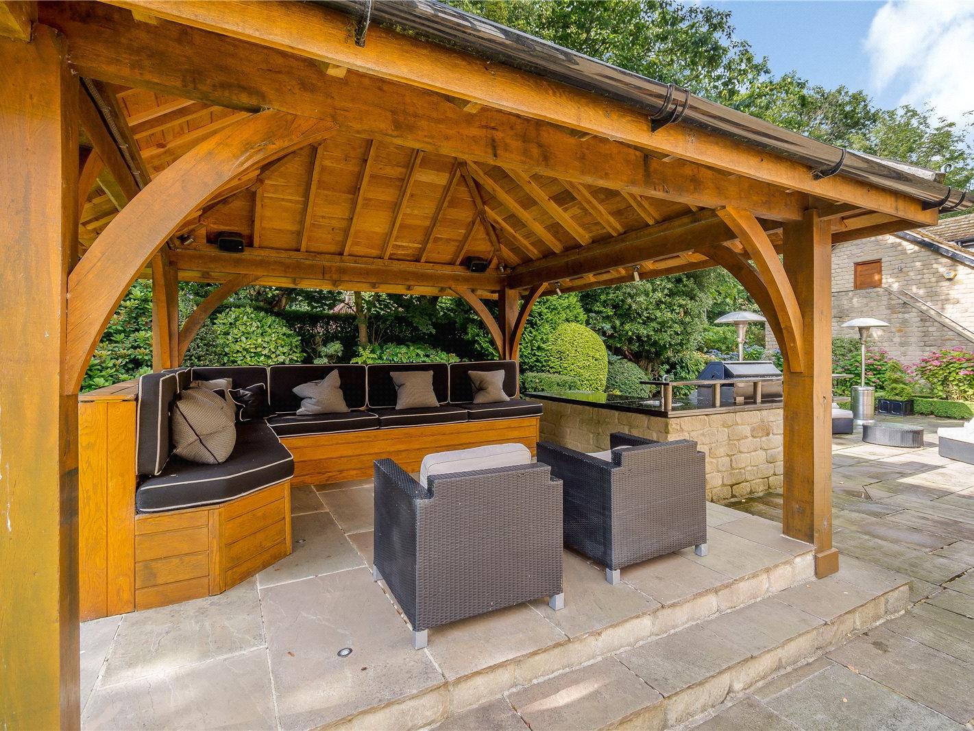 A sheltered seating area in the garden is perfect for BBQs and summer parties.