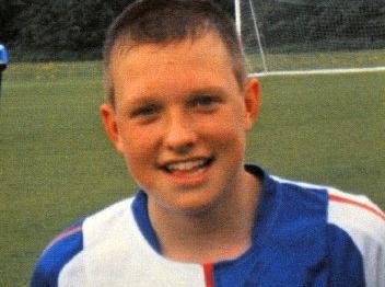 Is that beaming grin familiar? Pictured here in a family photograph from this England defender's days as a teenager with Blackburn Rovers academy.