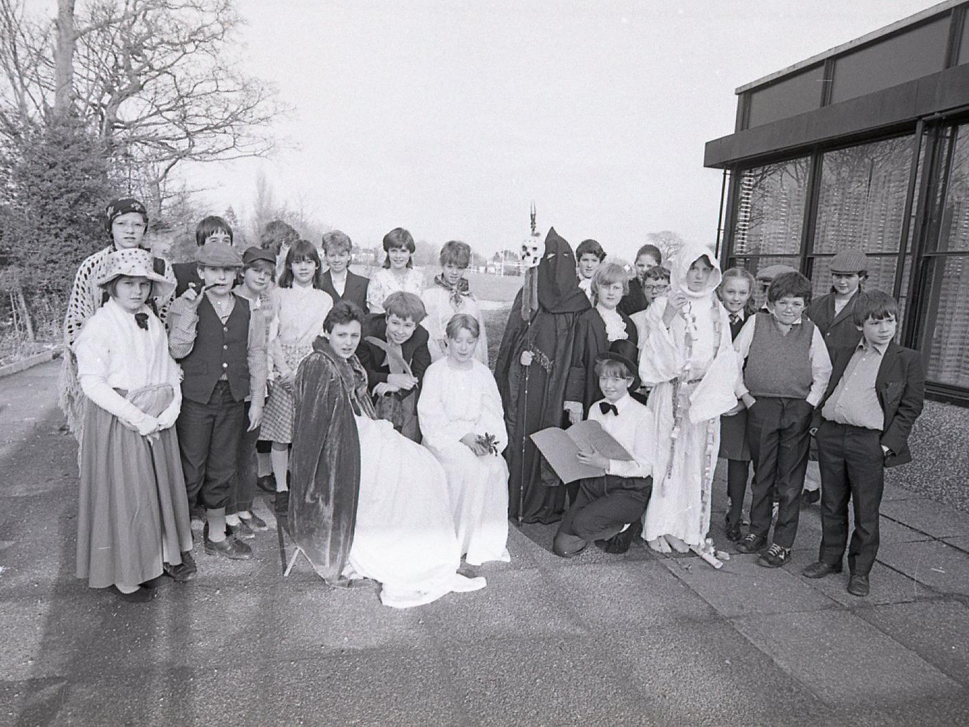 Pupils are in the throes of a late late Christmas show. More than 25 youngsters at Broughton High School, near Preston, are staging Charles Dickens' famous Christmas Carol. Pictured above is Cathy Waller (centre) as Scrooge with other pupils - from left: Susan Payne, Sarah Wignall, Nicola Seed, Vicky Park and Leanne Callaghan. Other members of the cast are gathered behind