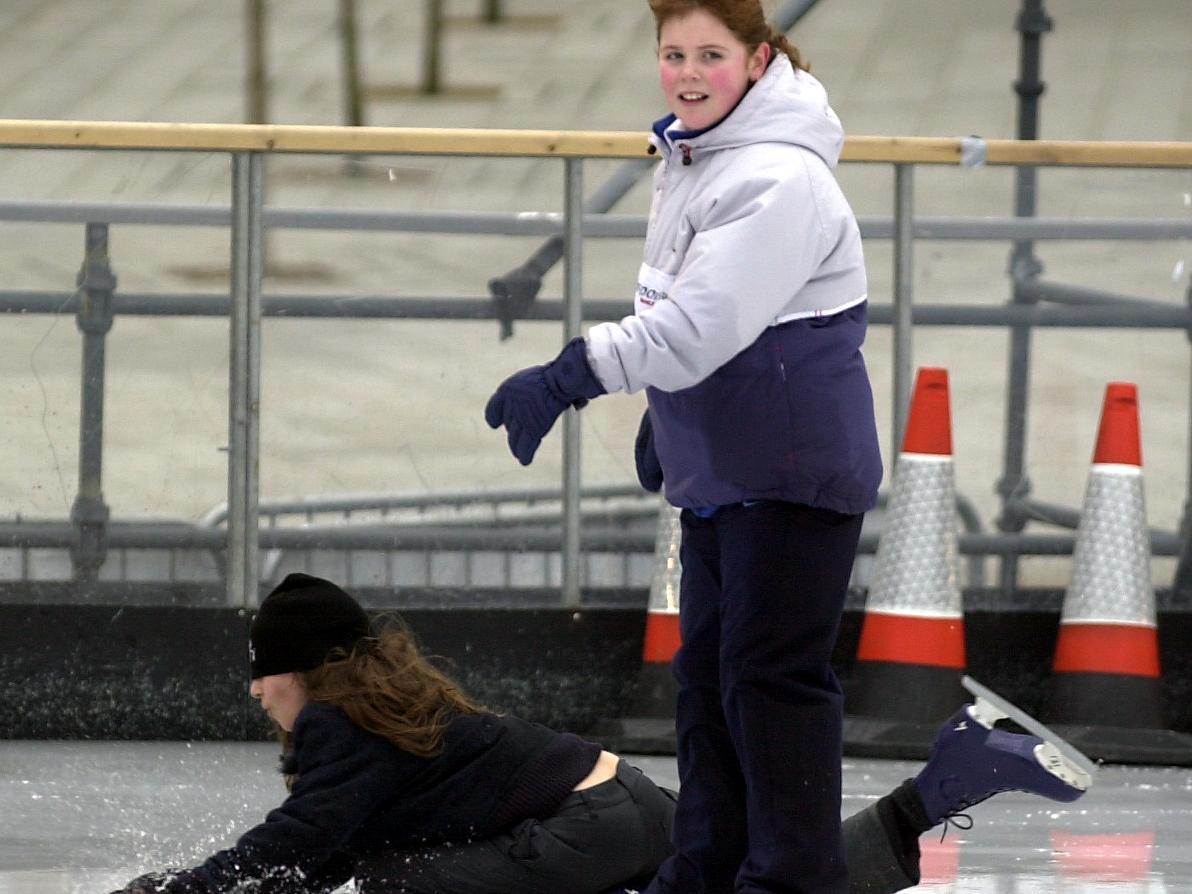 Harewood Primary pupil Aruhan Bisengaliev takes a fall watched by Katie Beard.