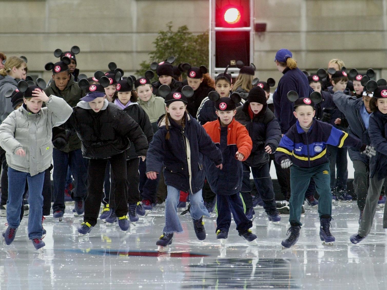 Quarry Mount Primary School pupils take to the ice wearing Mickey Mouse ears.