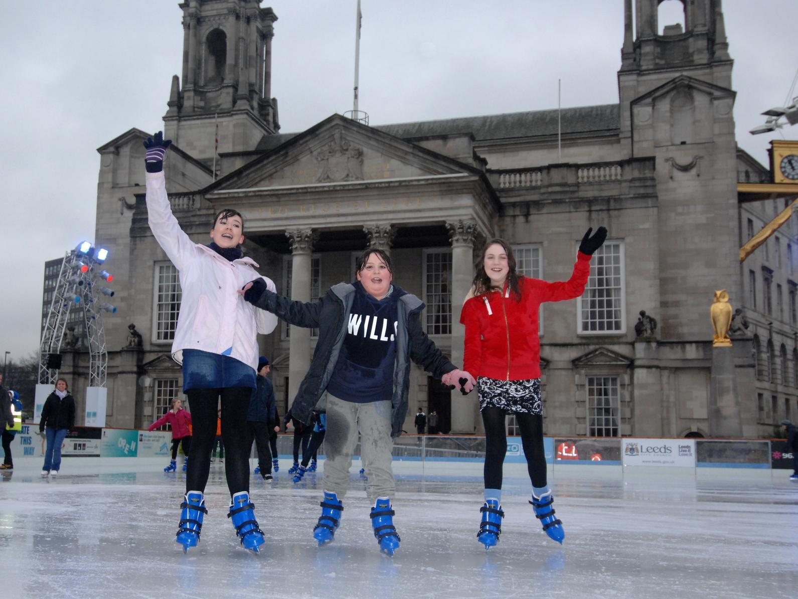 Young skaters Joanna Barnett, Jessica Guy and Keshyn Squires give our snapper a wave on the ice.