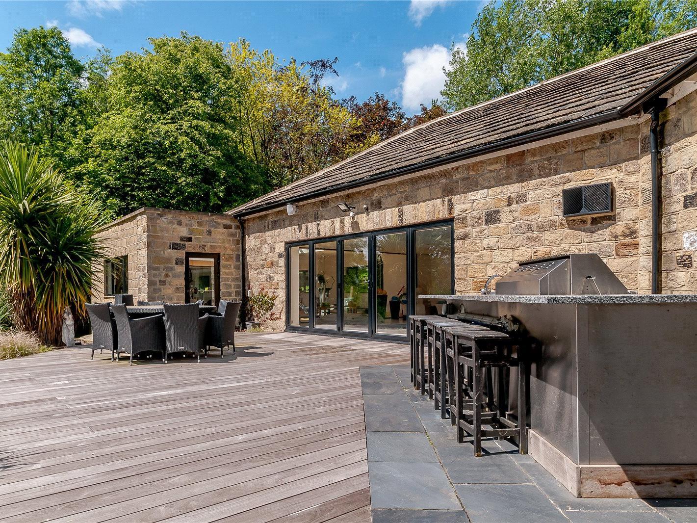 There are bi-folding doors leading out to a rear terrace, which is an ideal space for outdoor entertaining