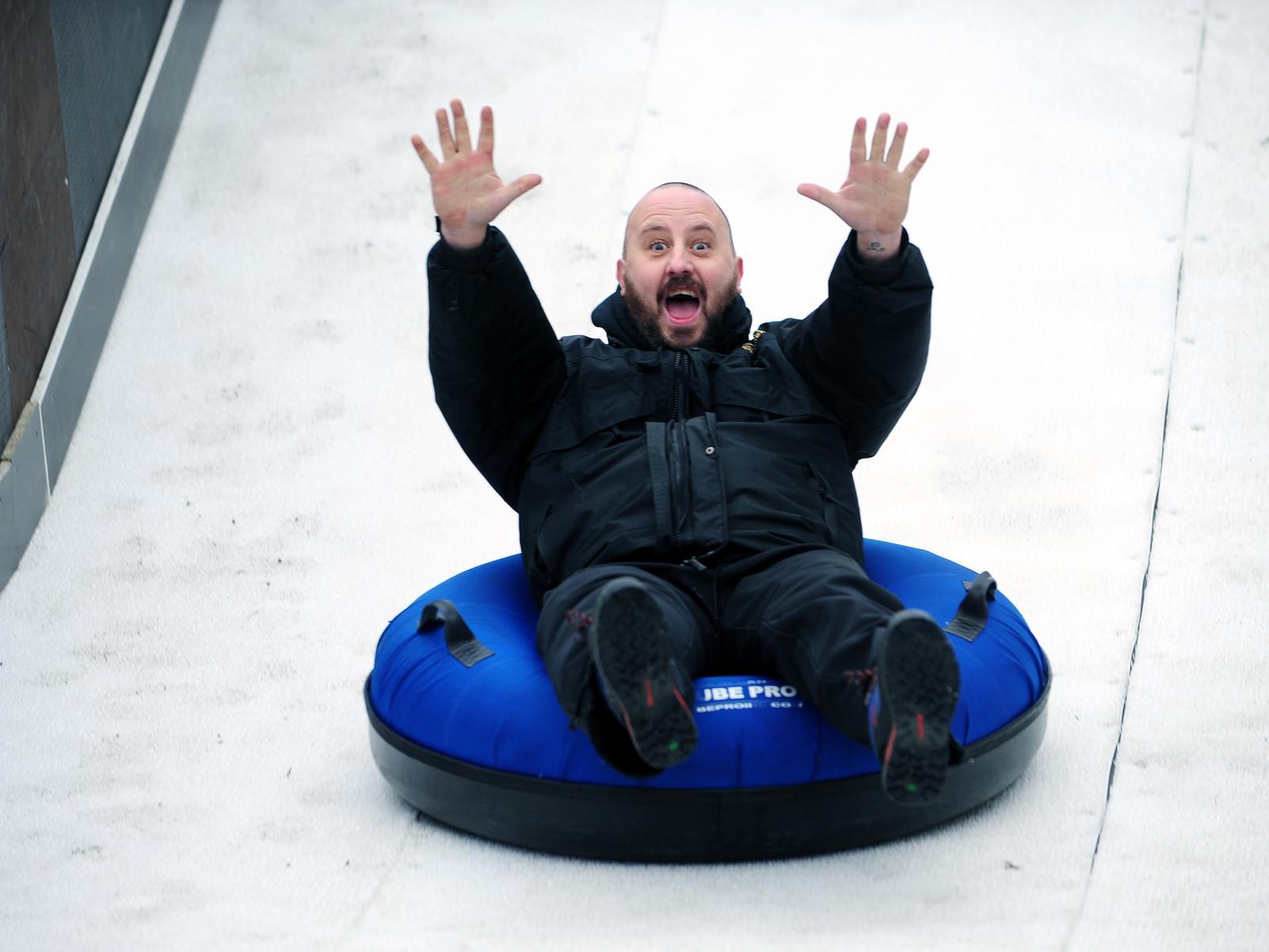 Haydn Hunter tests out the ice slide at the Ice Cube.