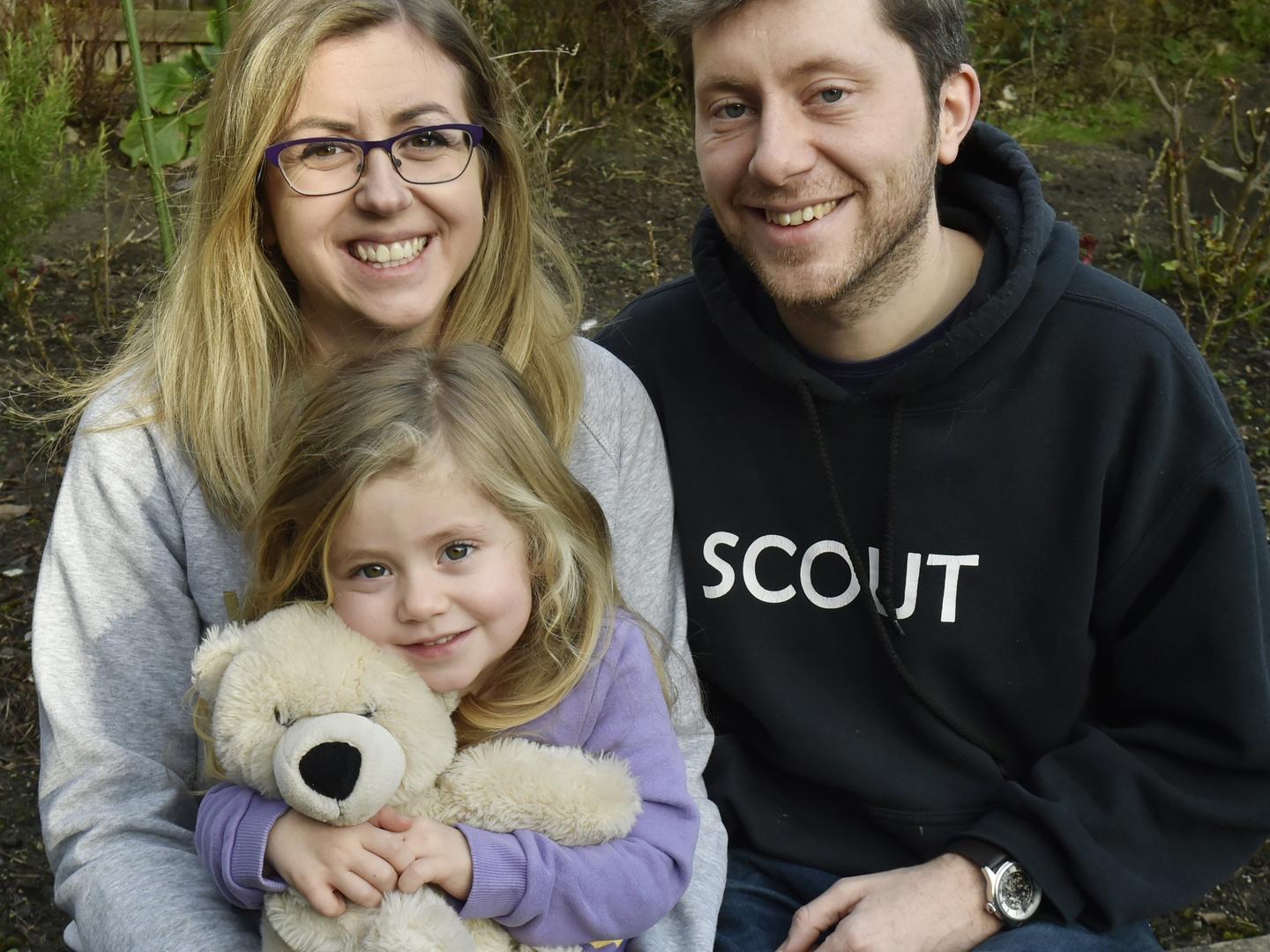 Claire and Andrew McLennan and daughter Ophelia, three, who is holding her late baby sister Alexandra's teddy.
Photo: Steve Riding