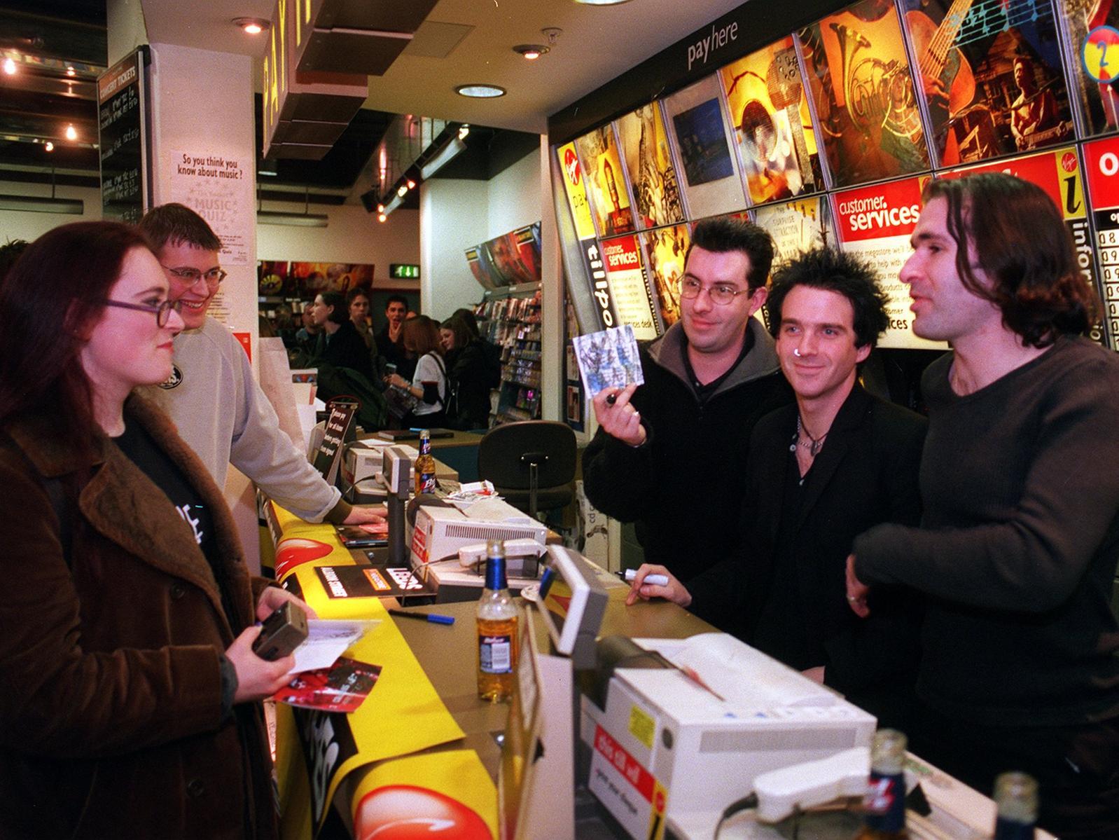 Members of rock band 3 Colours Red were at the Virgin Megastore on Albion Street. Pictured from left are Ben Hardman, Chris McCormack and Keith Baxter.