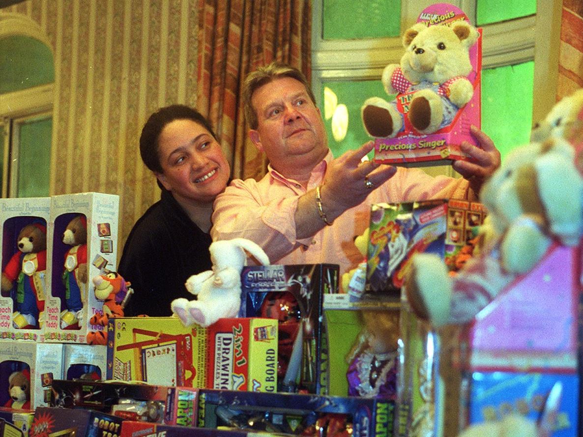 Three Legs pub Karaoke presenter 'Big Jackie' and landlord Geoff Rose, display toys for children at Leeds hospitals.