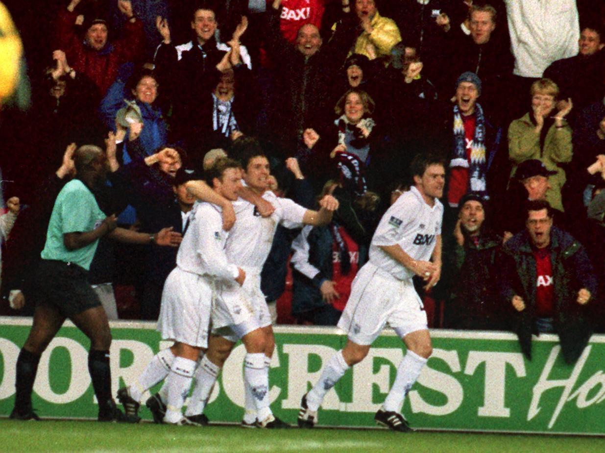 PNE players celebrate their goal at Wigan in April 2000, a game watched by 7,000 of their fans at the JJB Stadium
