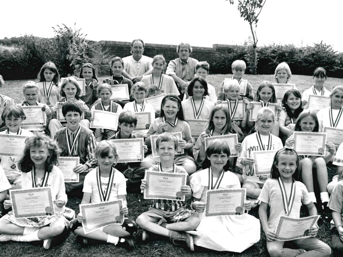 Dane Royd School, pupils with their choir medals, 1995.