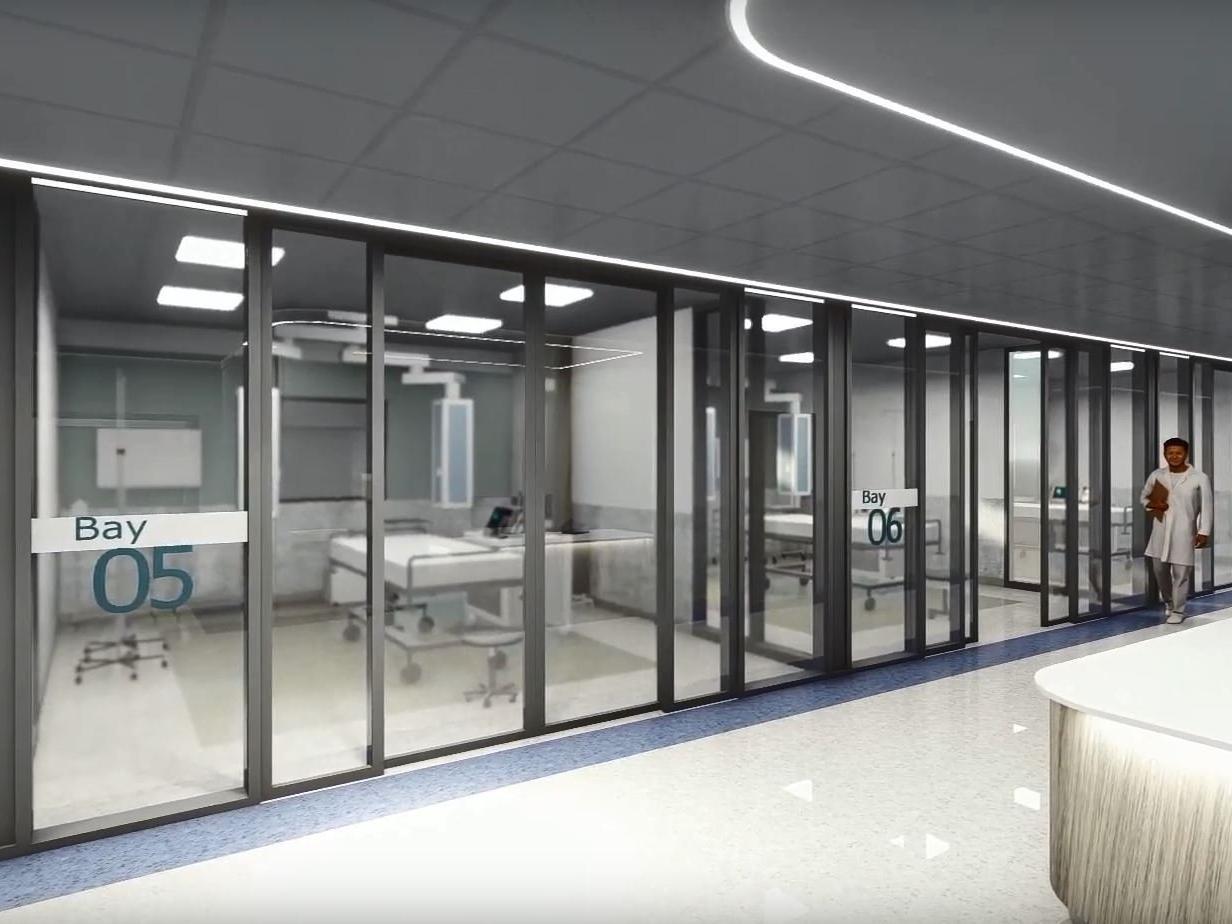 The corridor extends to the right, with further bays for treating patients.