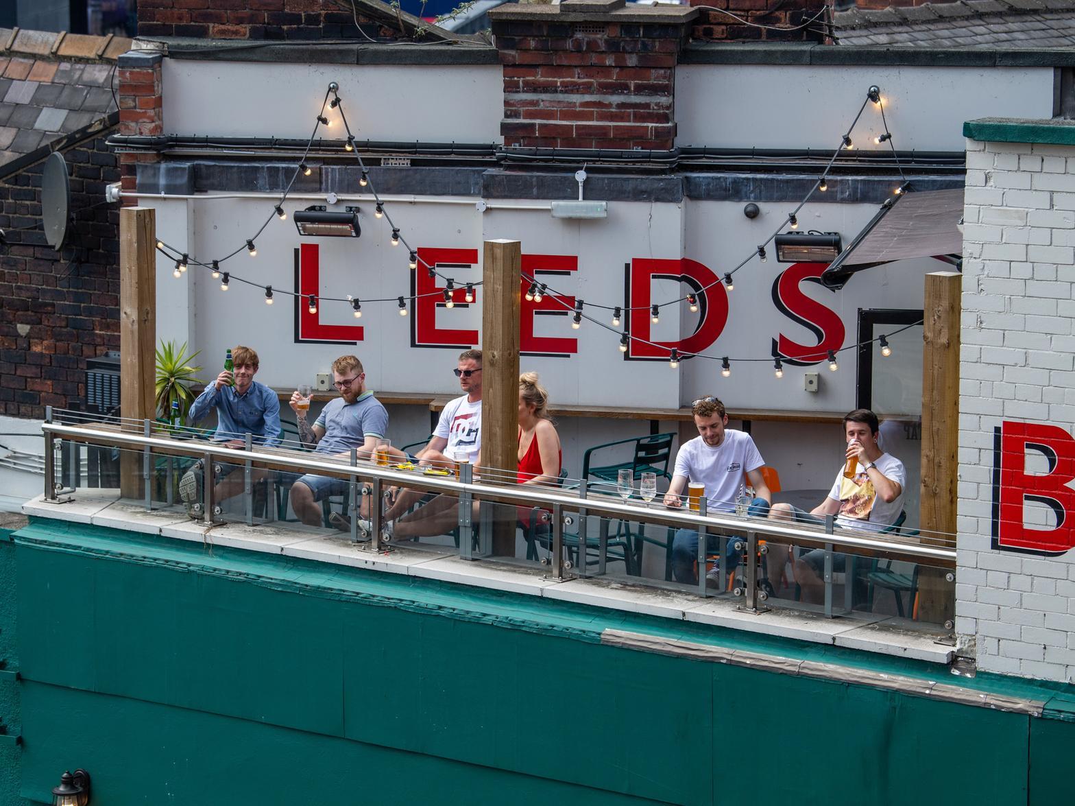Drinkers enjoying the sunshine on the pub's terrace last summer. Picture: Simon Hulme