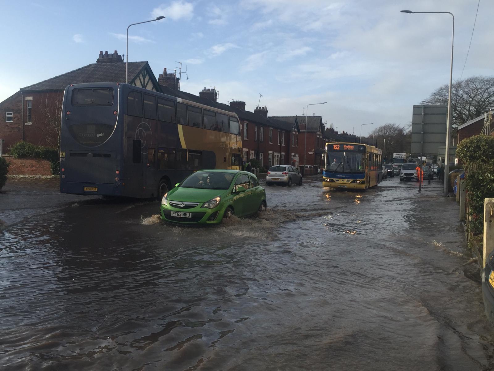 Motorists battle through the flooding.