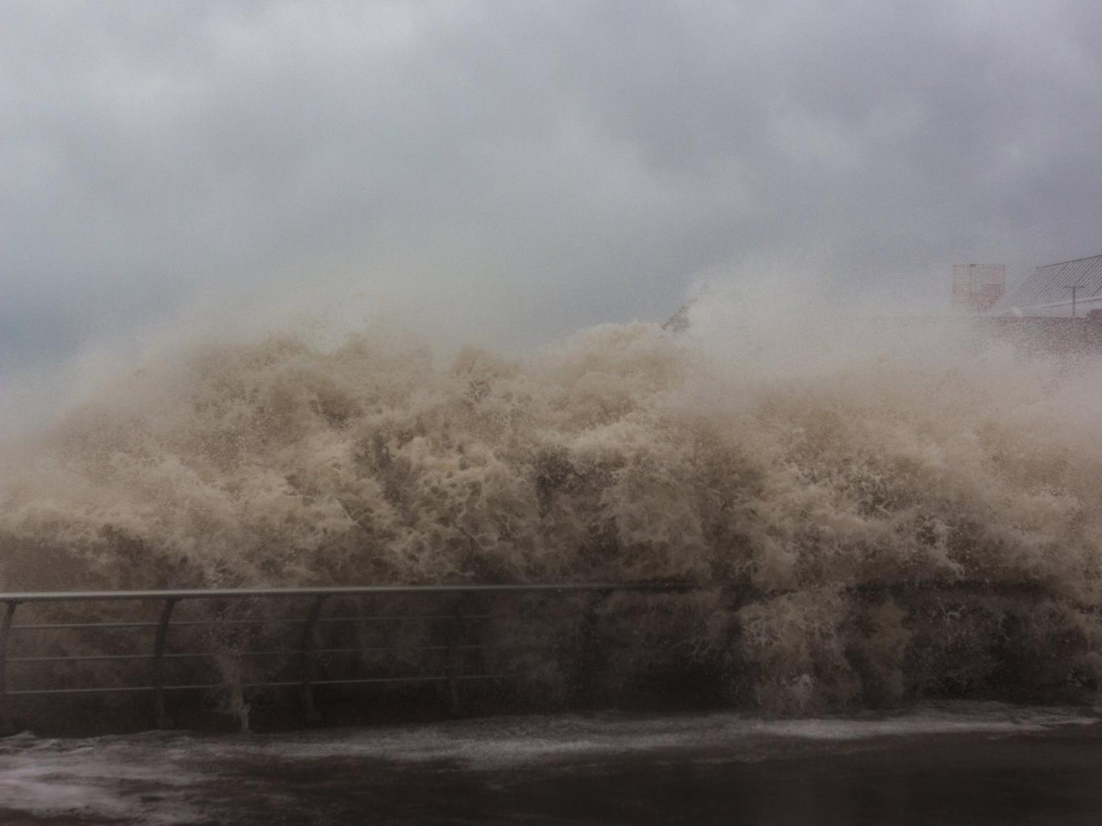 Waves crashing over the barriers along Blackpool seafront. Picture by Joseph Seager.