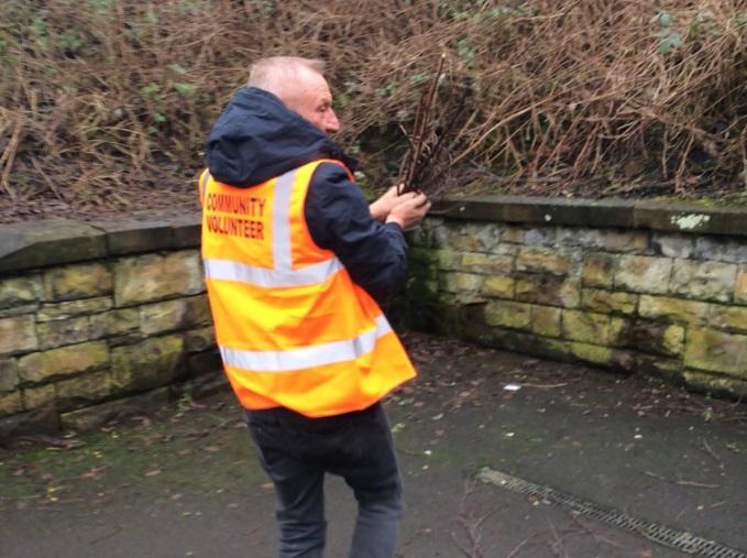 Community volunteers help to clear up at Bryn Station