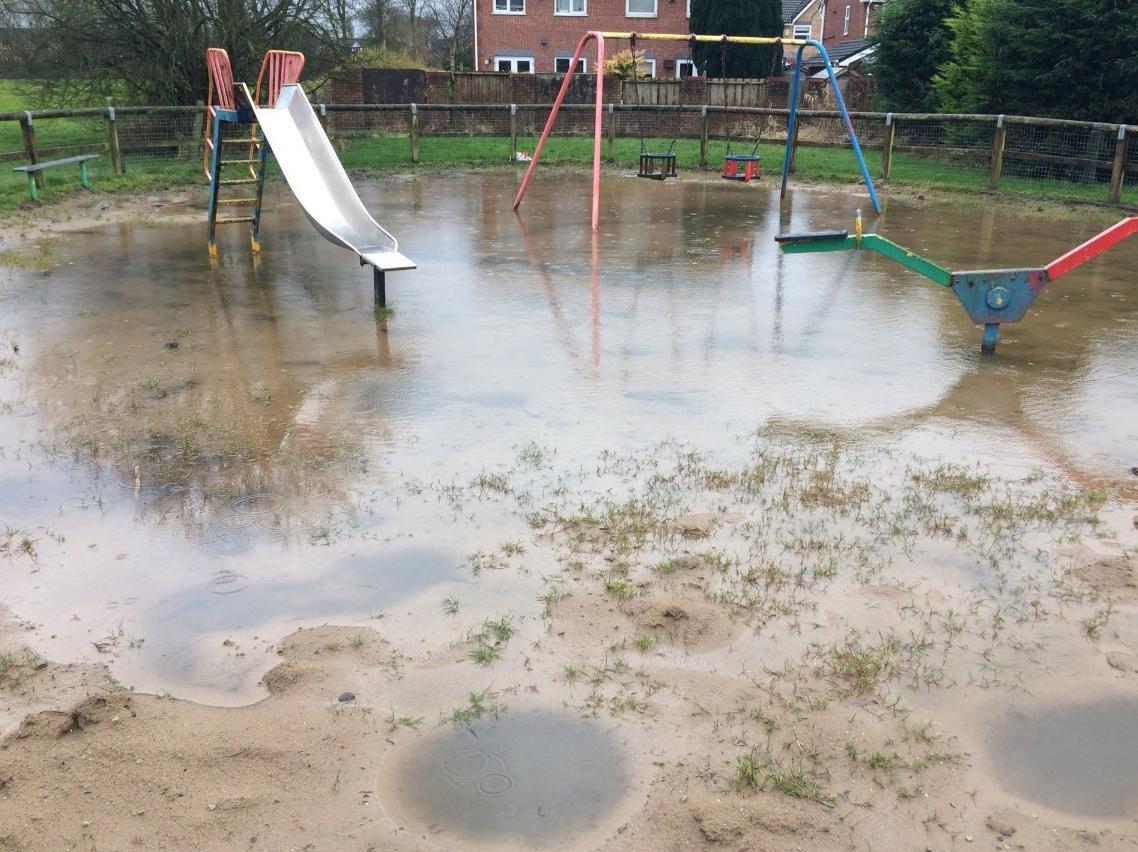 A flooded play area in Bryn