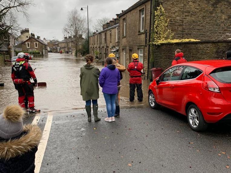 Emergency services on scene in flooded Whalley