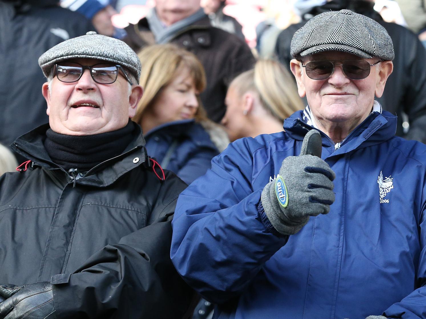 It's all good from one fan, as a pair sit ready for the derby to begin.