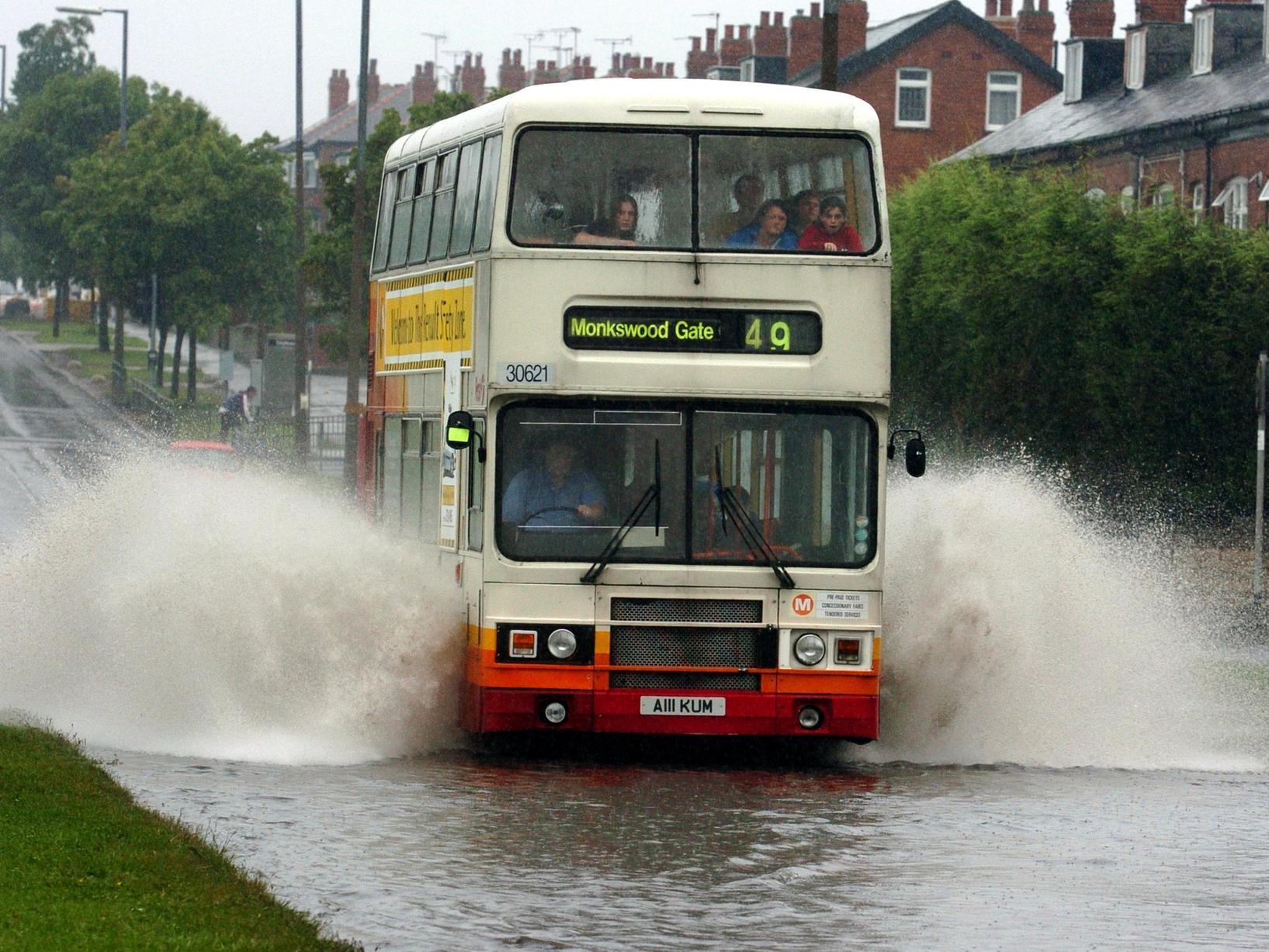 A bus makes its way through flooding on Easterley Road after torential rain hit Leeds.