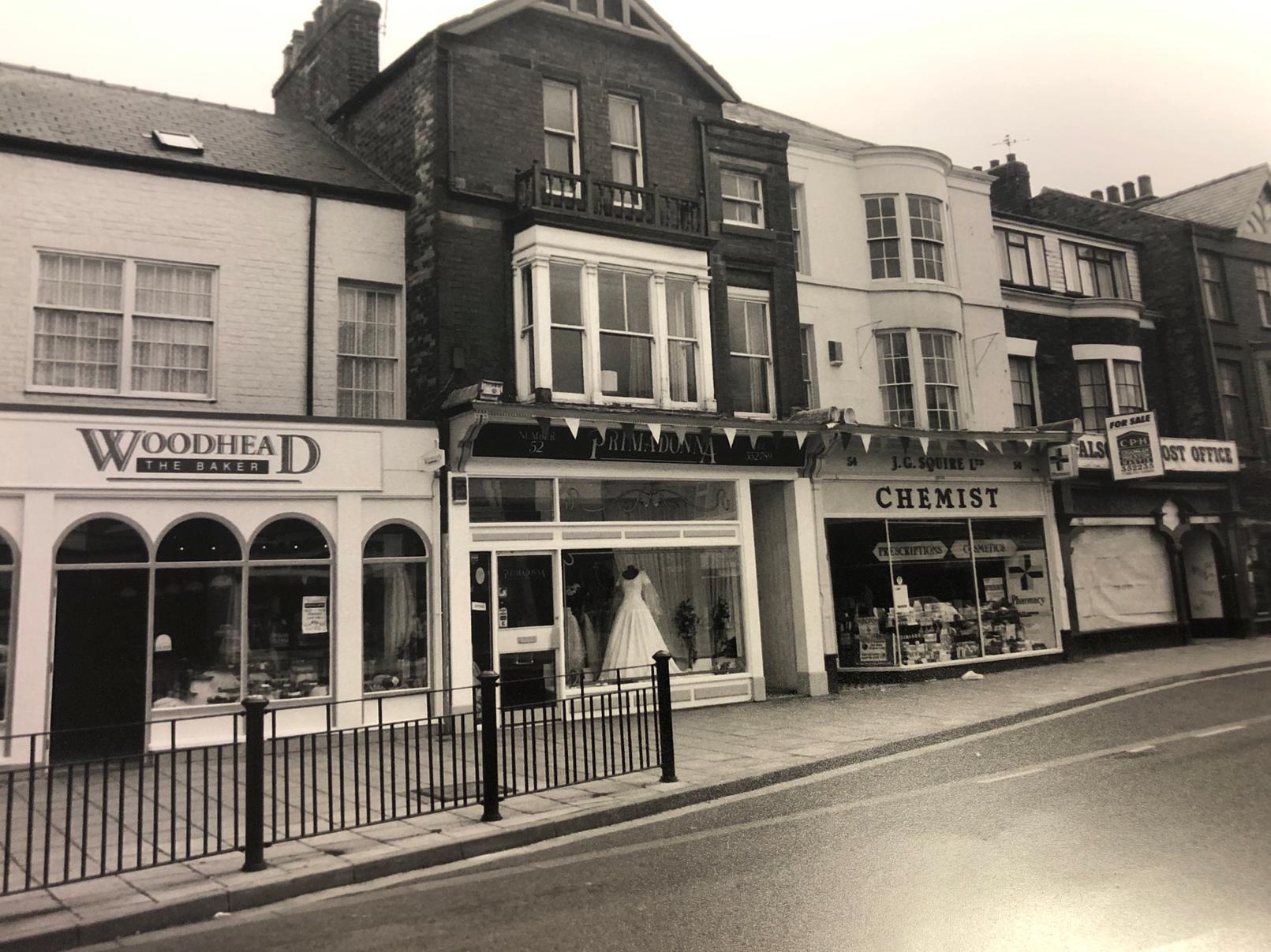 Of all the shops in this picture from 1995, only one remains today - J. G. Squire Chemist. Bakery chain Woodhead is now Falsgrave Funeral Service and wedding shop Primadonna is Aim High Online Ltd.
