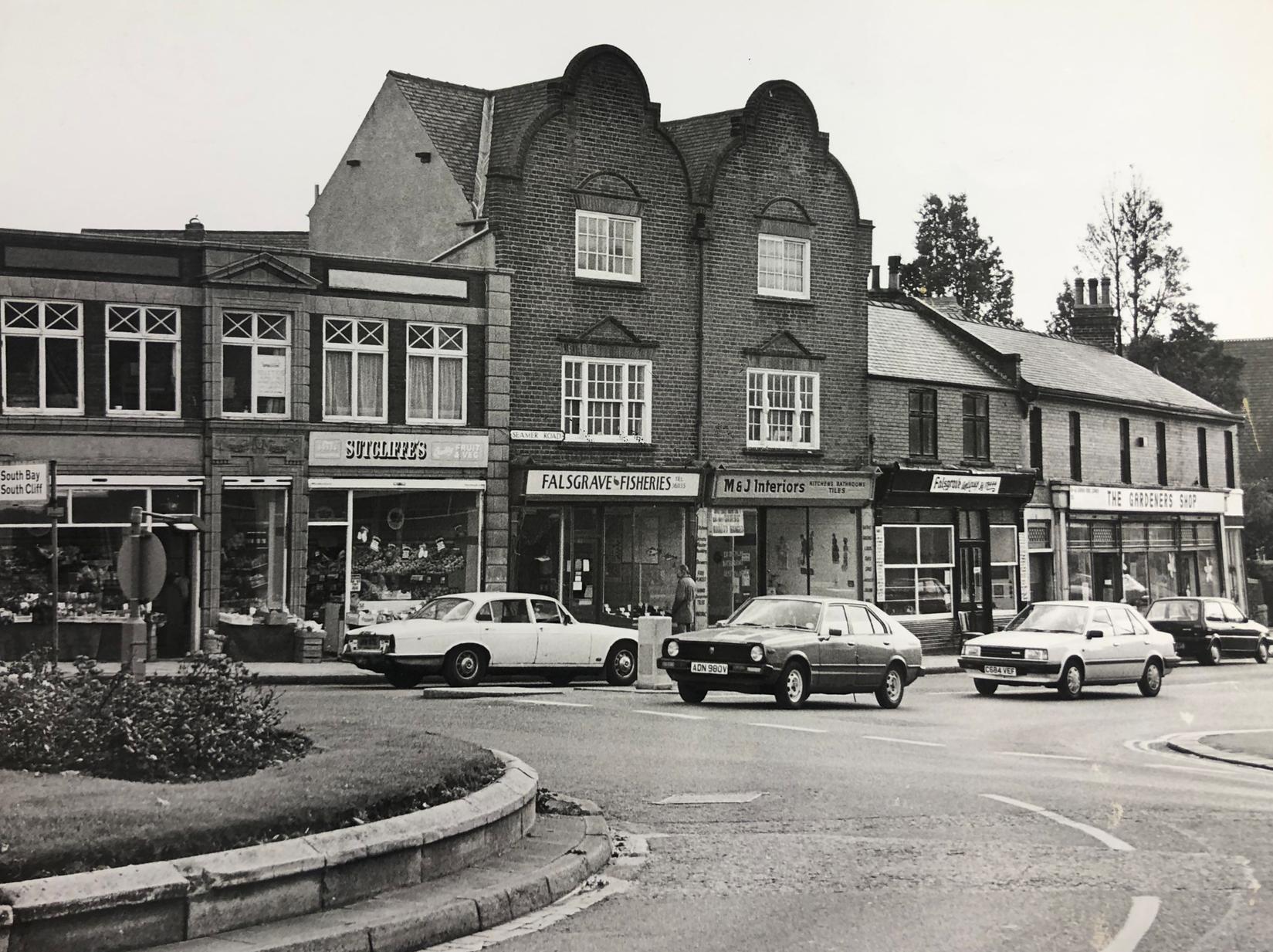 This part of town looks very different now - the roundabout is no more for a start. But also, the large buildings in the centre have been turned into flats, whilst the gardeners shop on the corner was most recently Cartridge World.