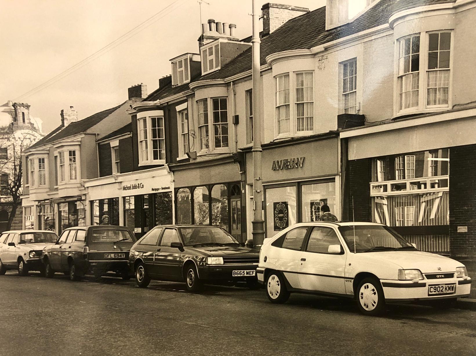The design of these cars show how much time has passed. While the buildings are still there today, the businesses they house have changed - do you remember these?