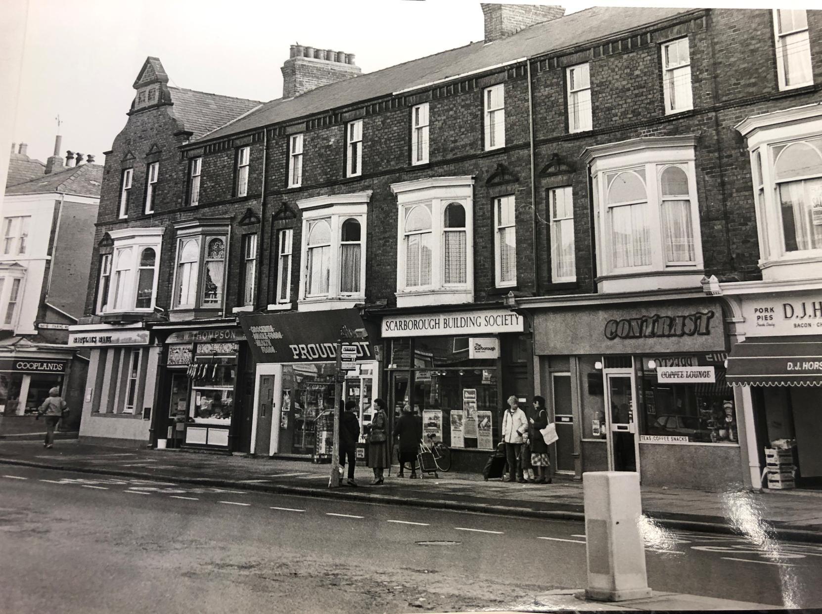 The two buildings tot he left of Scarborough Building Society are now Pattison's fruit and flower shop. Contrast Cafe is still there and the building society is now the Firk Inn.