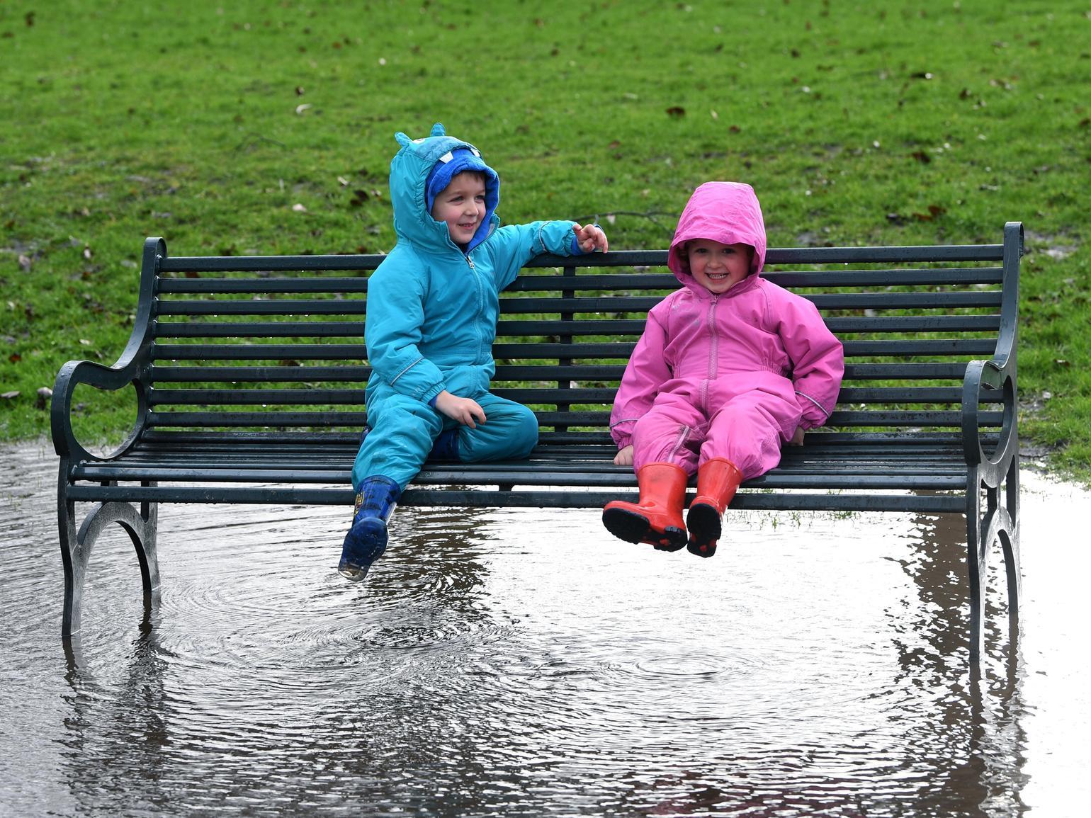 Wesley and Poppy Gower have fun in the flood water at Kirkstall Abbey during storm Ciara.