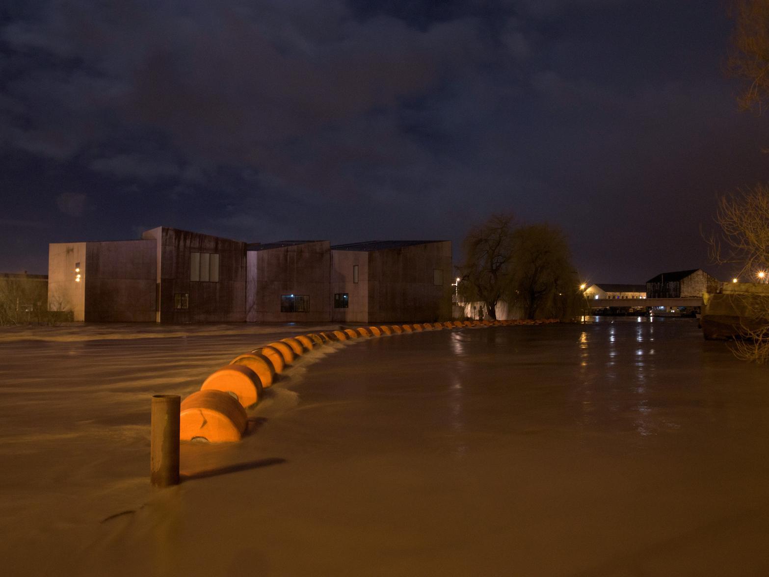 David Land captured a photo of the same area on Sunday evening, showing water close to flooding the surrounding businesses.