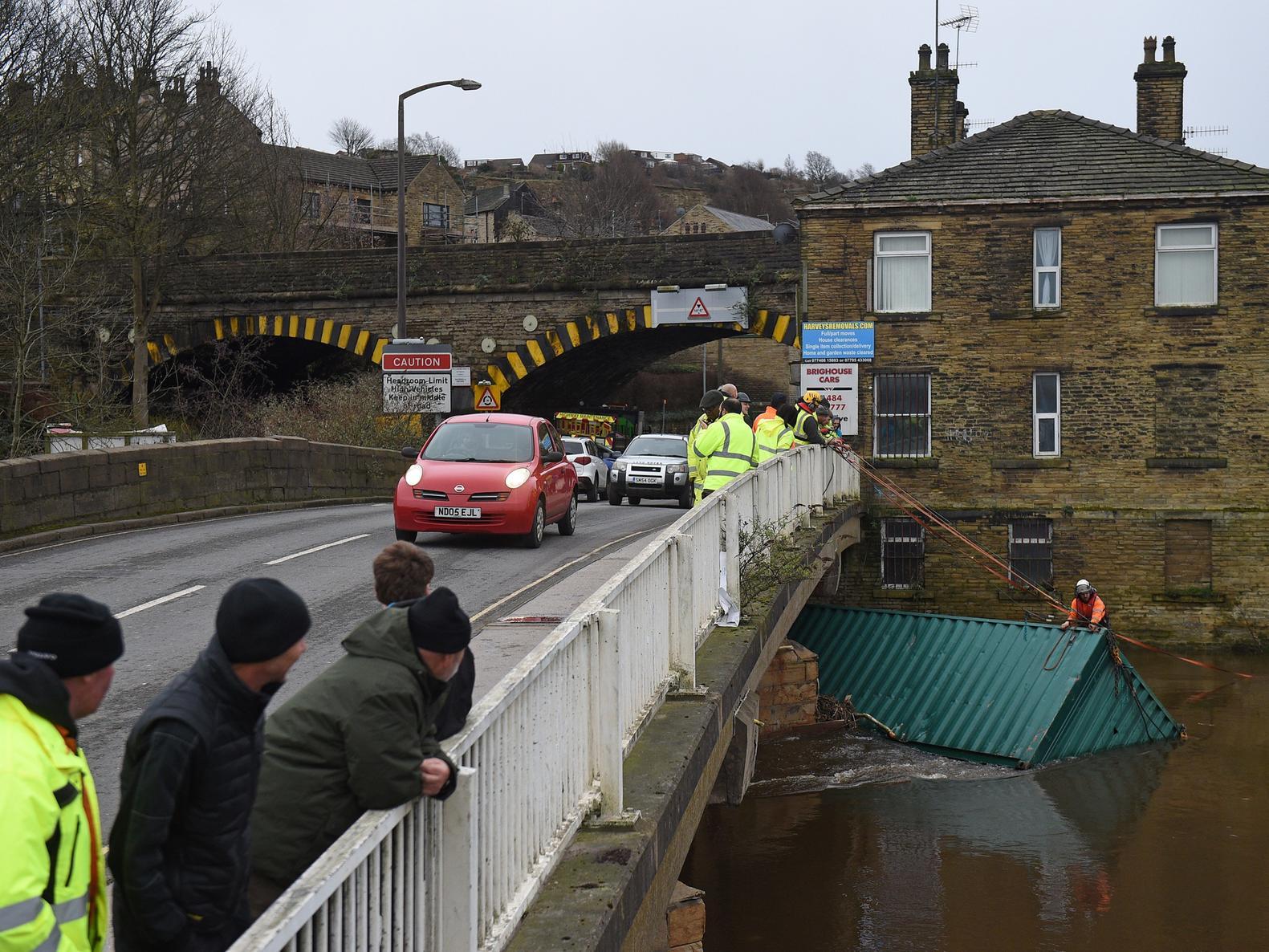 Further upstream, a shipping container became lodged under Rastrick Bridge, Brighouse, after a weekend of strong winds.