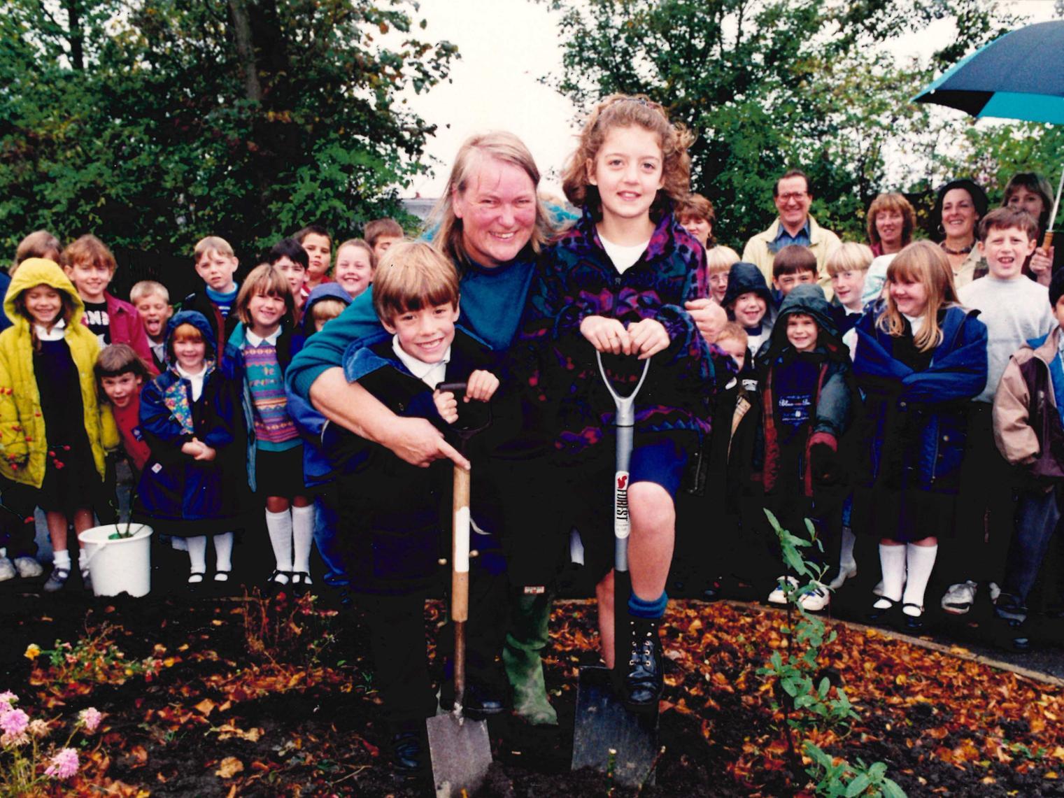 Newton Hill Junior and Infants School, pupils plant rose trees, 1996.
