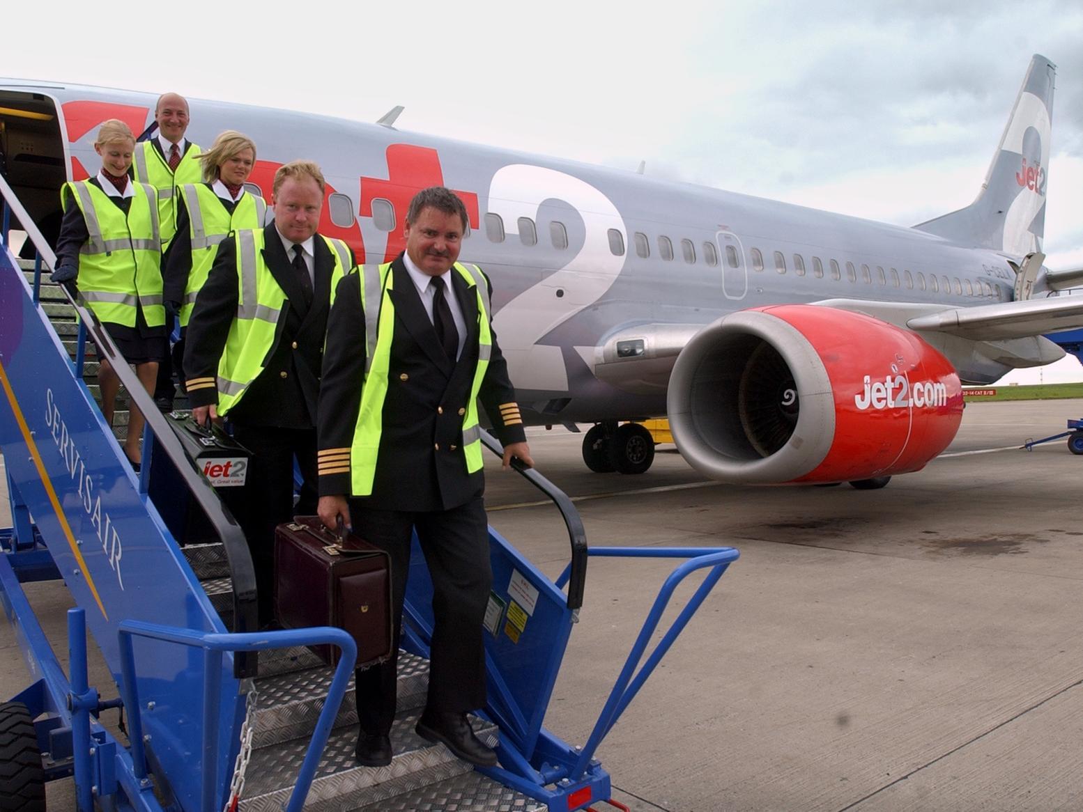 Jet2 cabin crew pictured leaving the aircraft.